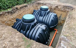 Exposed septic tanks burred in the groud